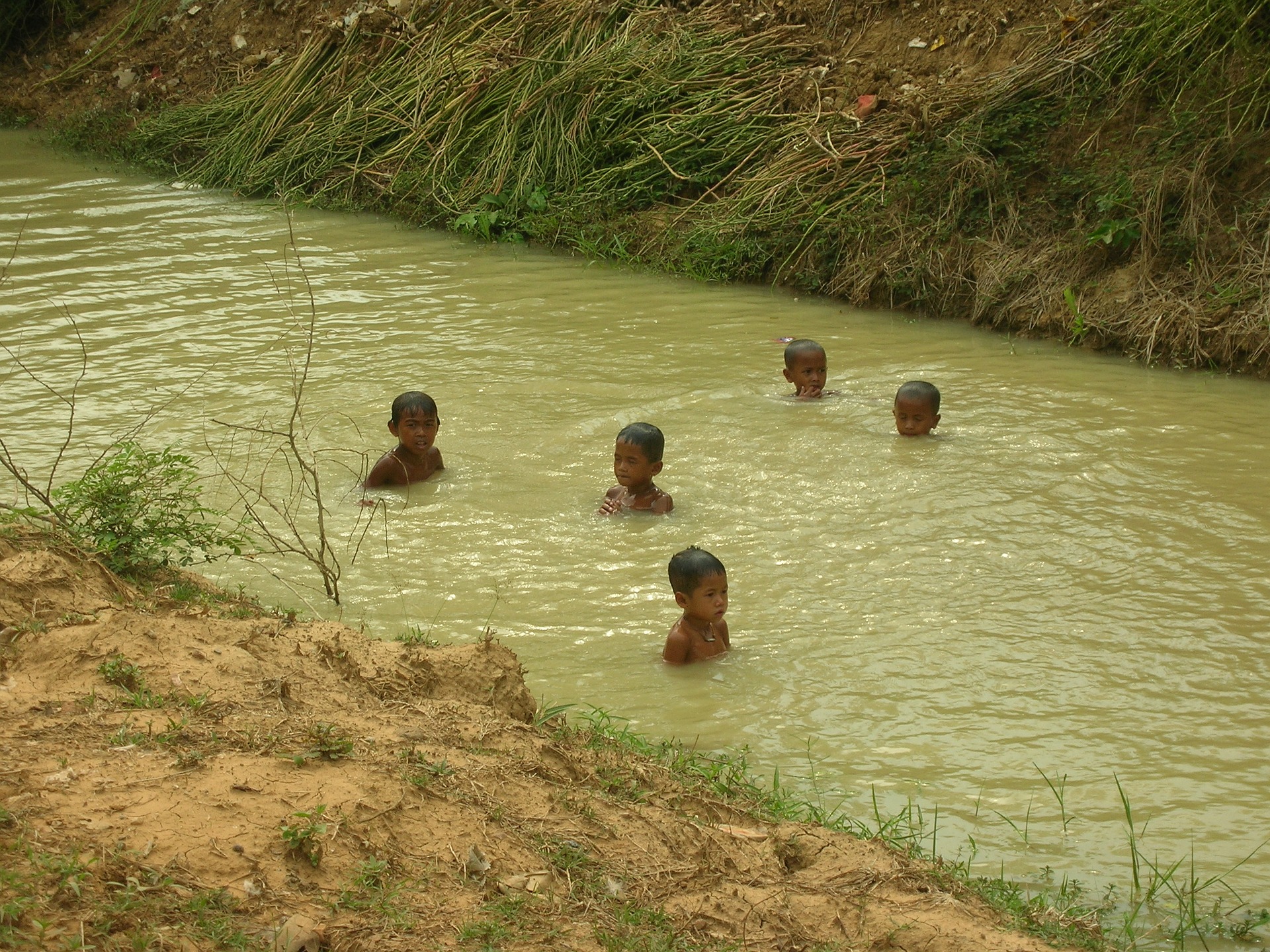 Children Swimming in a man made canal