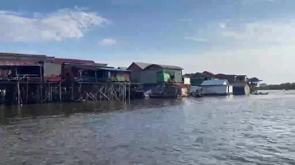 Painted stilt houses at Kompong Khleang standing in high water