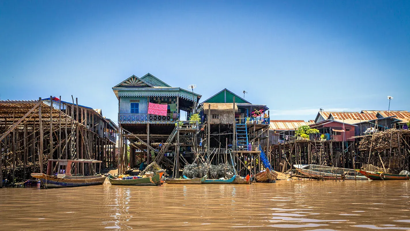 Red-roofed stilt houses at Kompong Phluk at high water