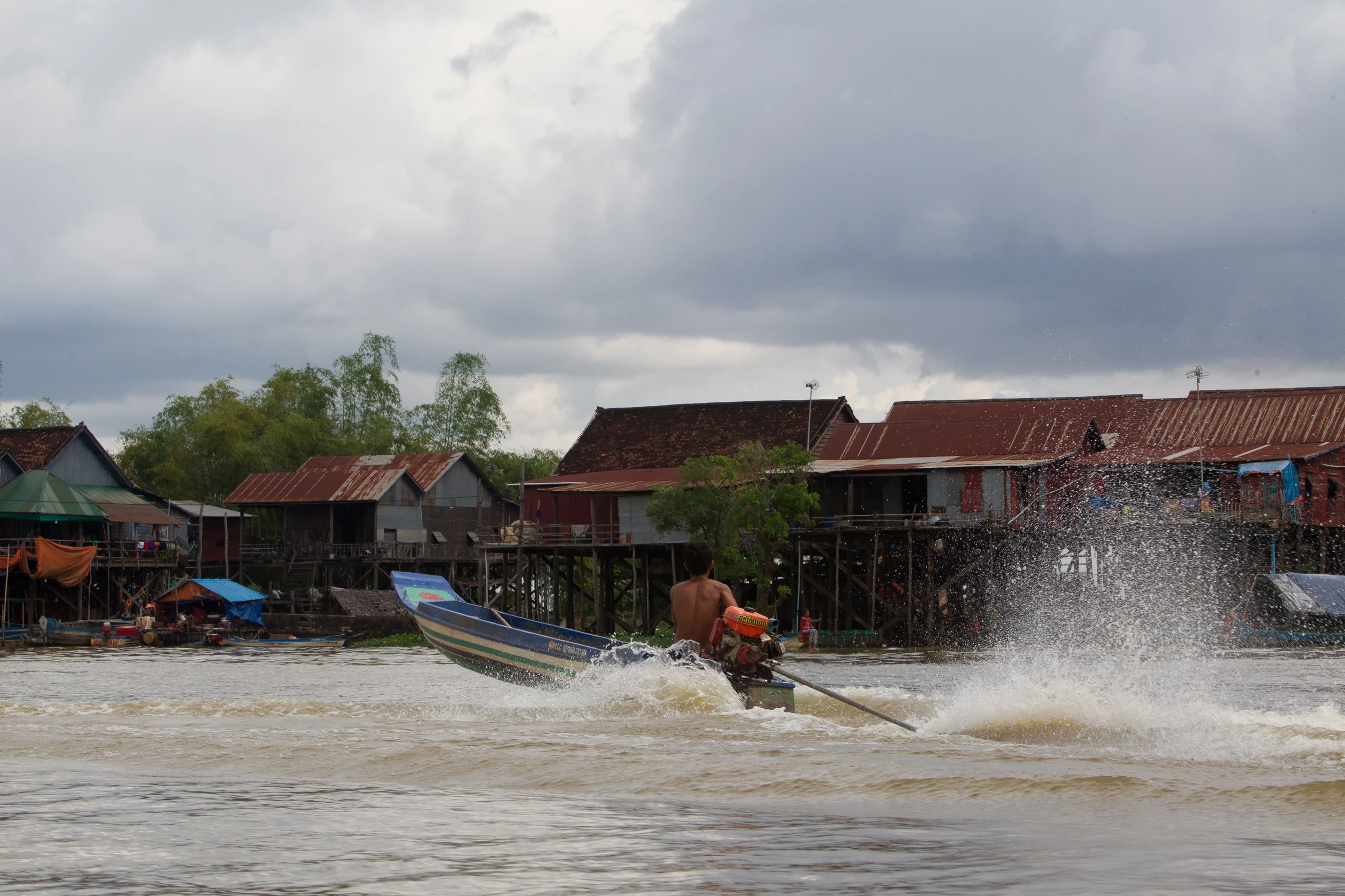 A boat crossing a channel on Tonle Sap Lake