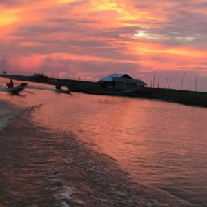 Sunset on a Private Floating Village Tour